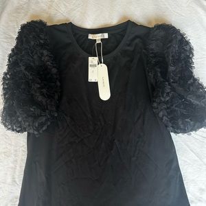 Flat white puff sleeve black top